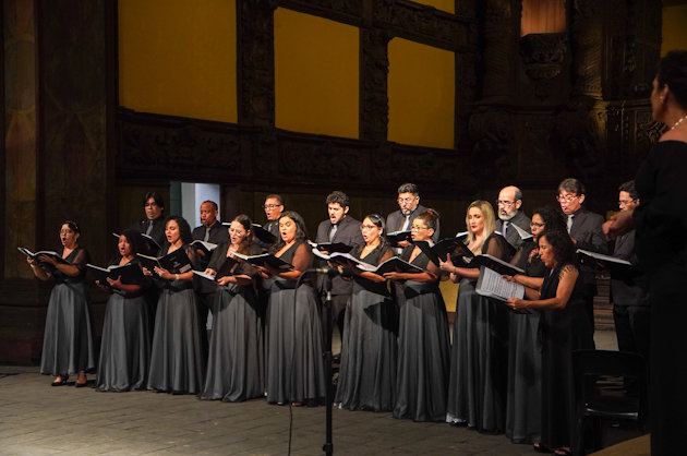 a group of people in black gowns and caps