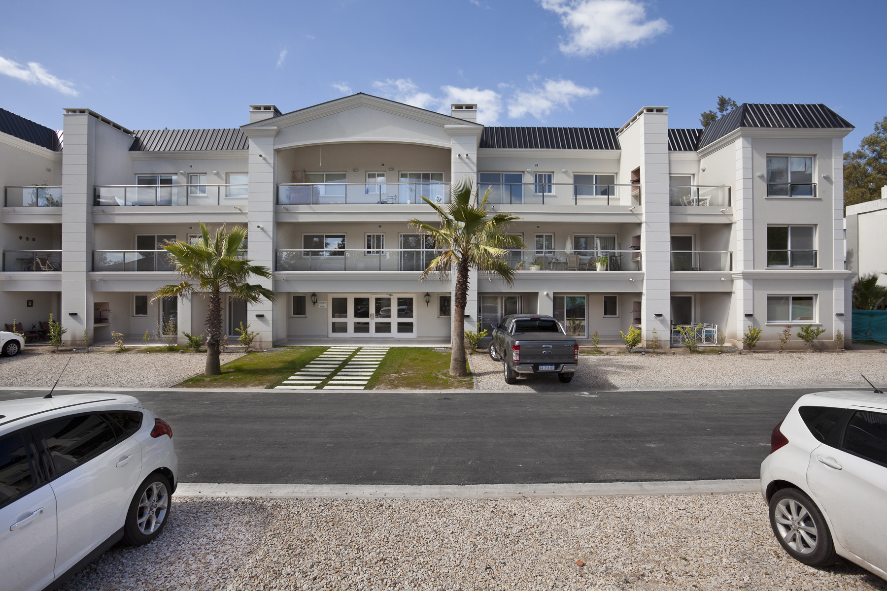 a building with cars parked in front