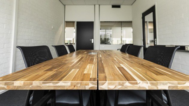 conference room with six chairs around a table