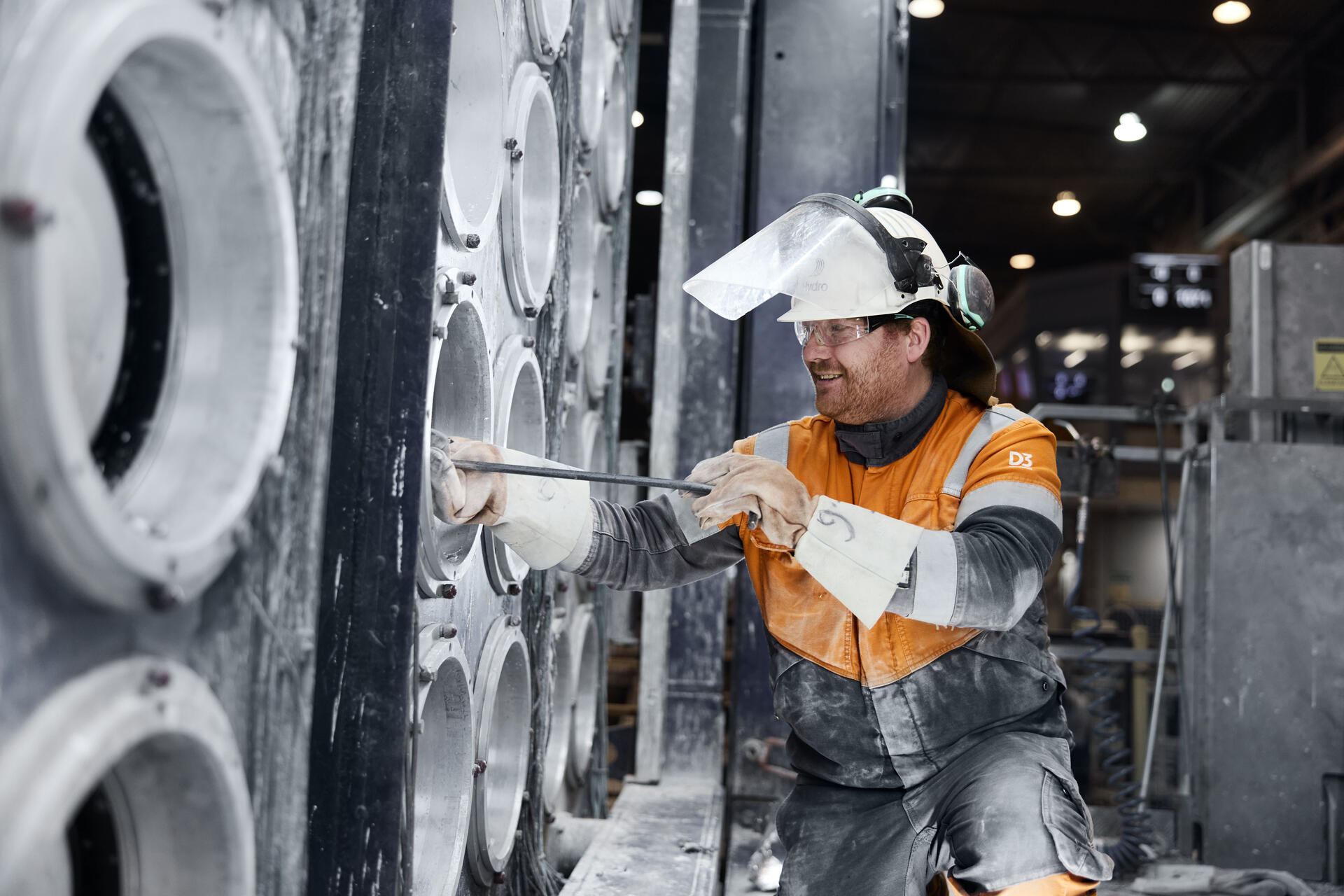 a man wearing a hard hat and safety gear
