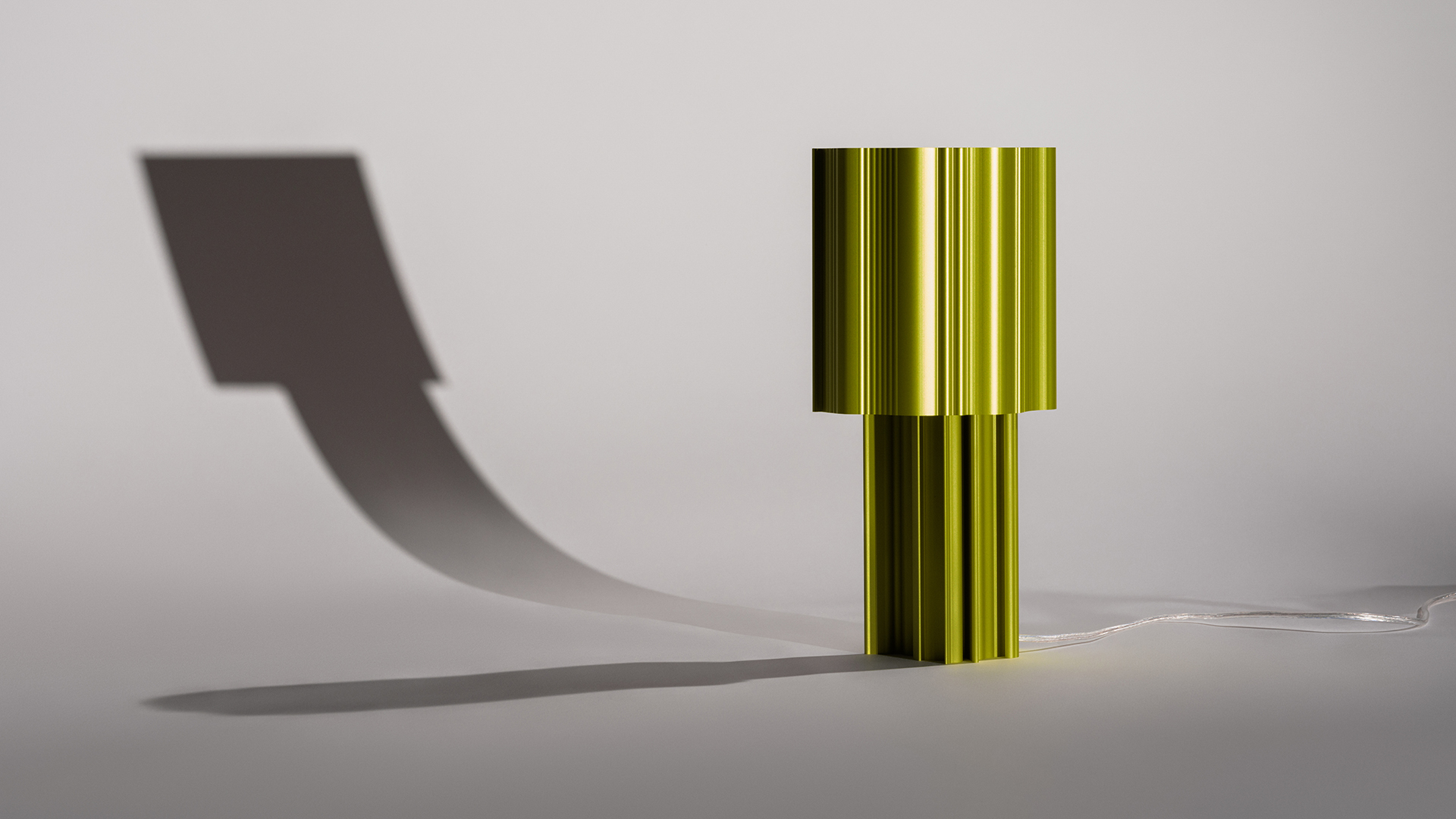 a green cylinder with a cord