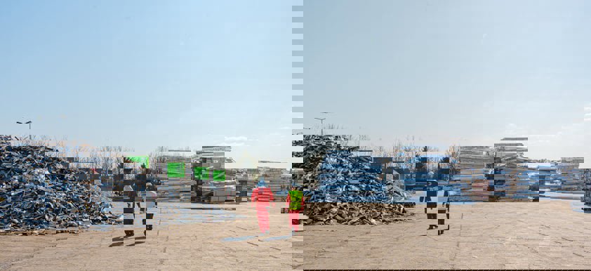 two people walking on a road