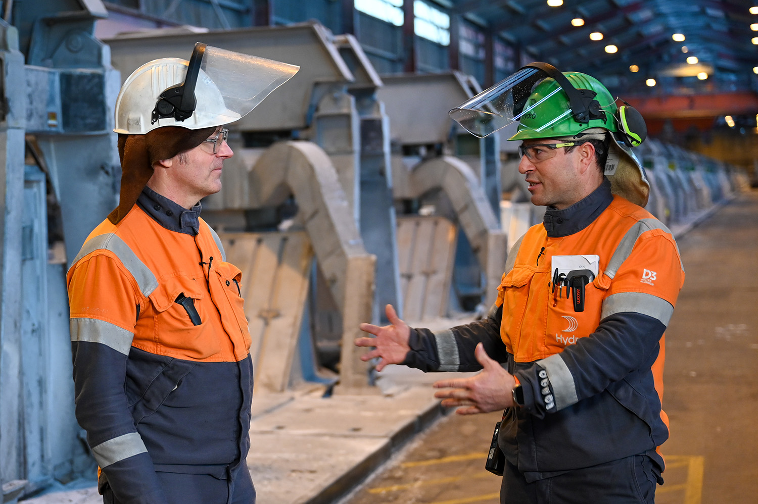 a couple men wearing hardhats