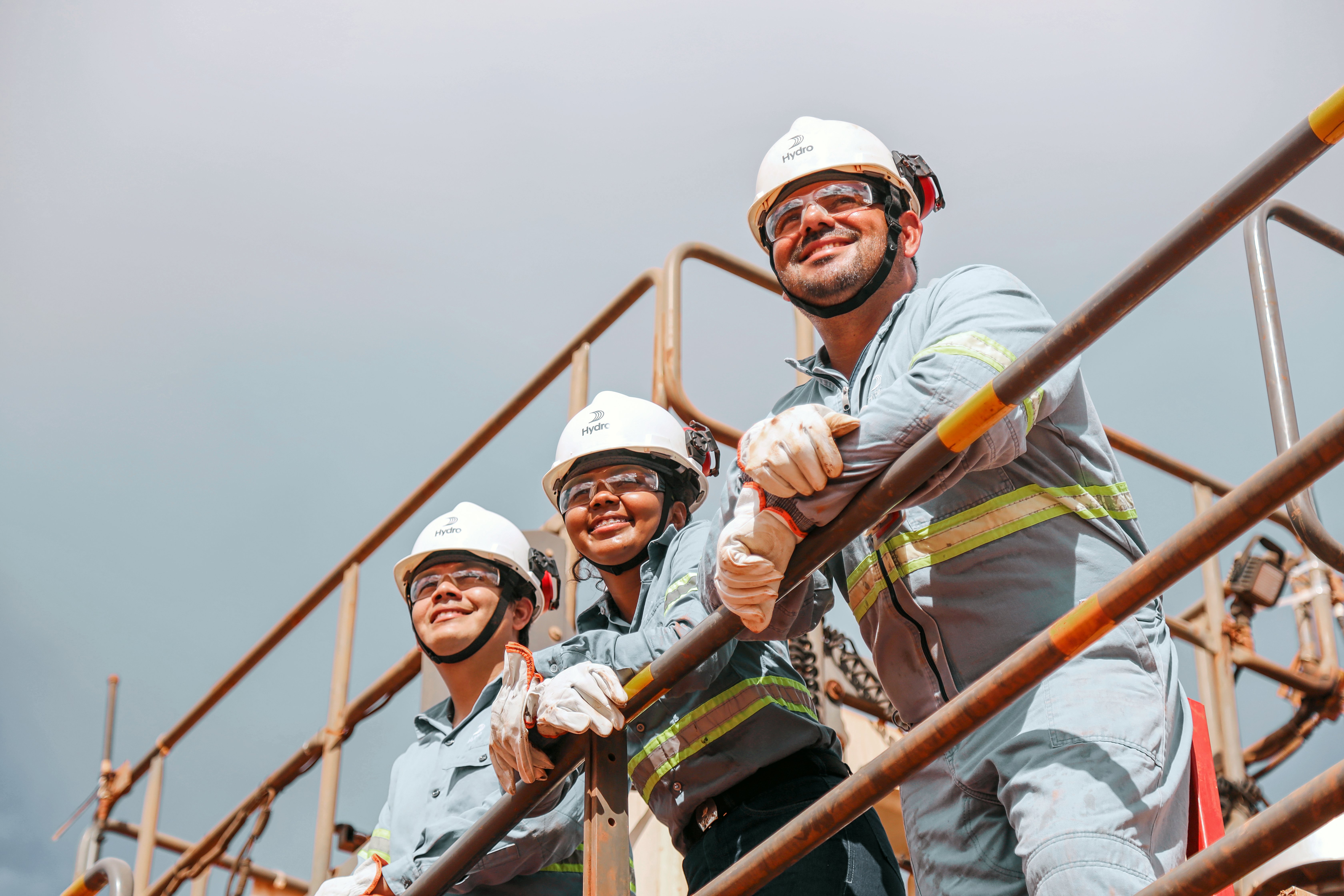 a group of people wearing hard hats and helmets