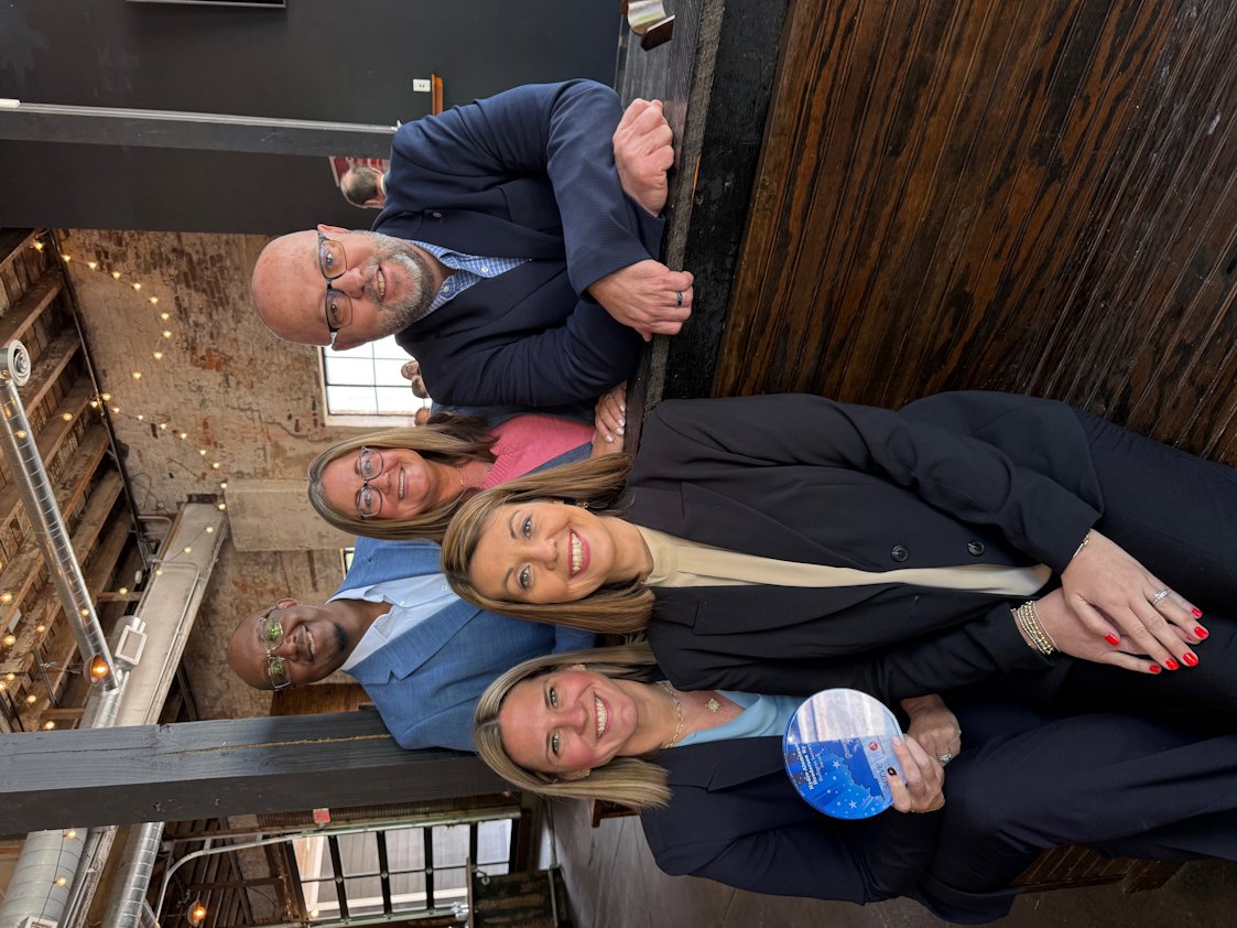 a group of people posing for a photo