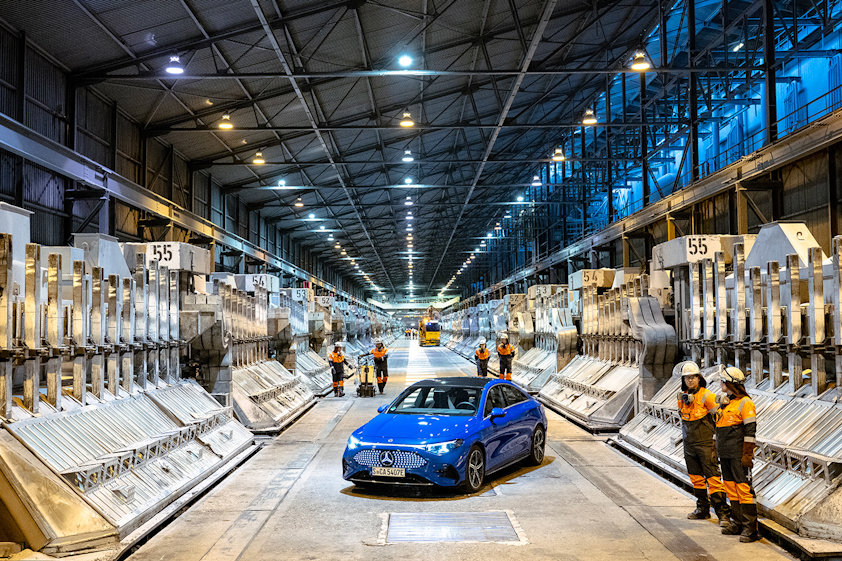The fully electric Mercedes-Benz CLA in the electrolysis hall at Hydro Årdal, where Hydro produces low-carbon aluminium for European industry.
