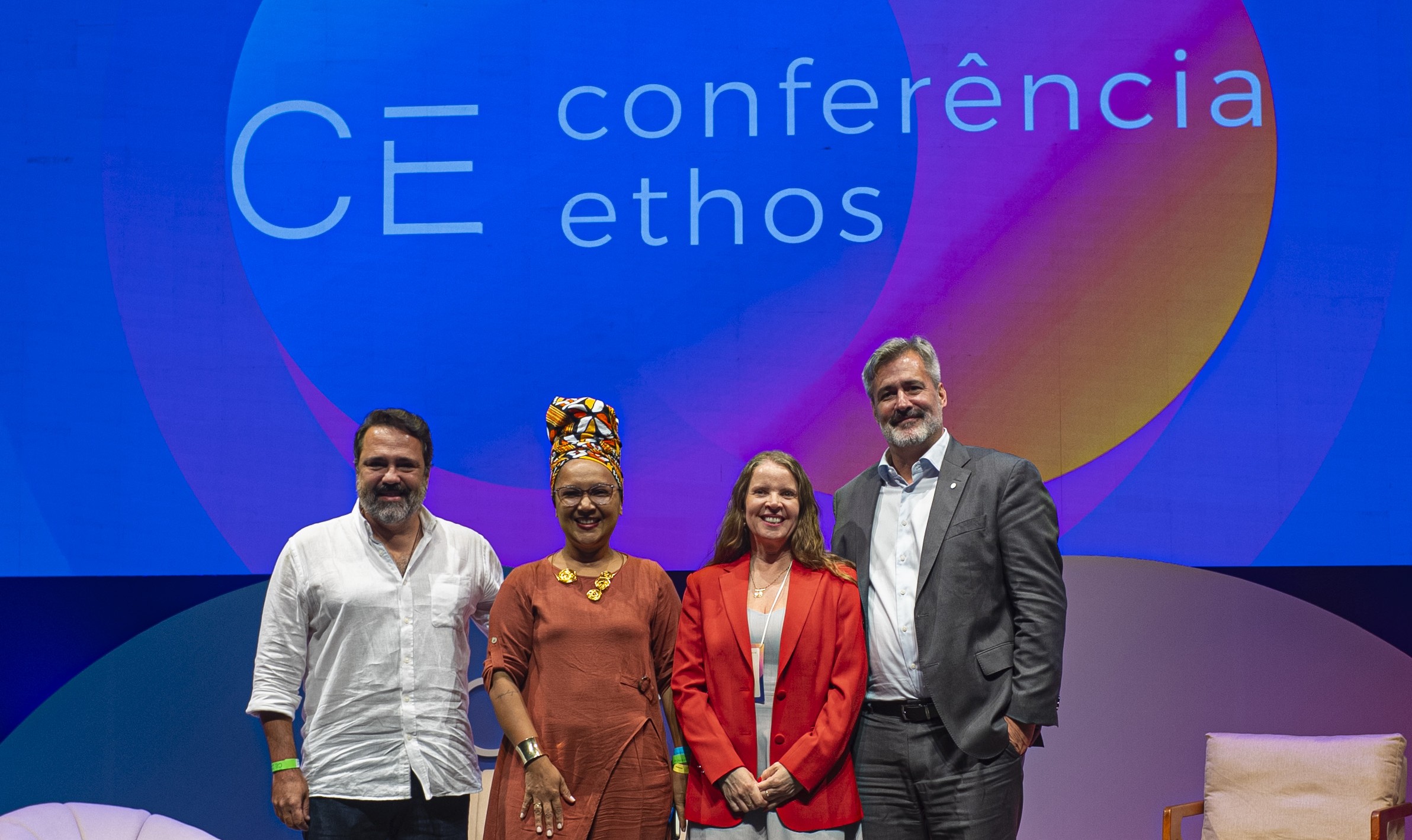 a group of people standing in front of a sign