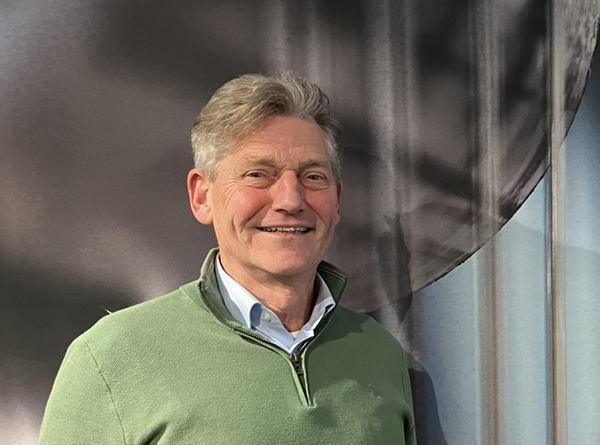 a man smiling at the camera