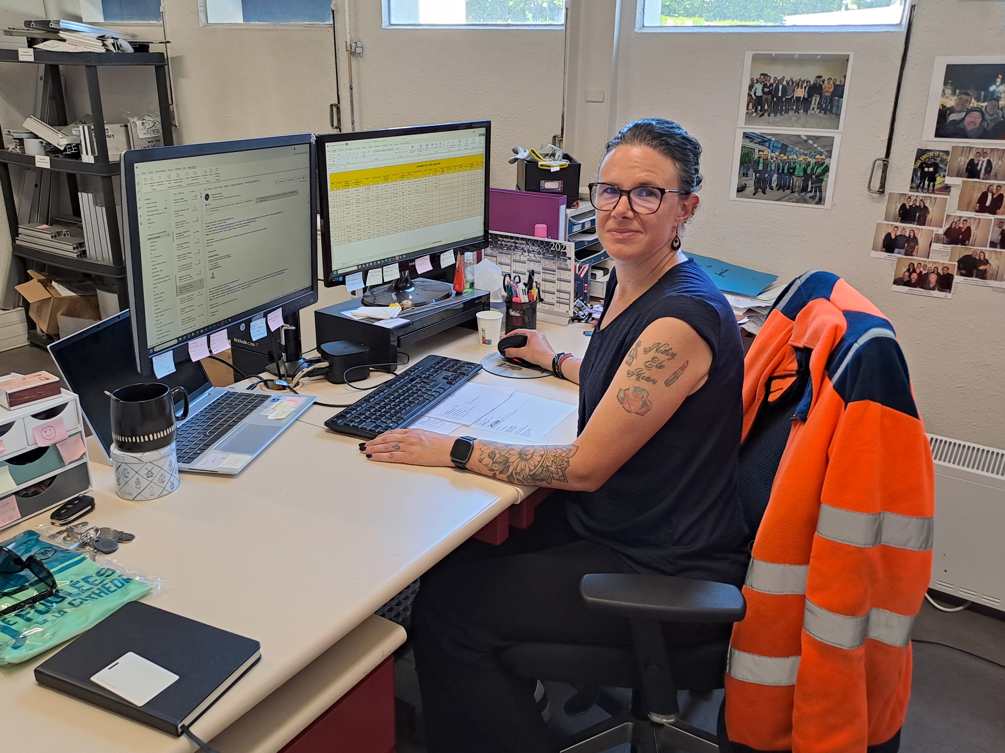 a person sitting at a desk with a backpack on the back