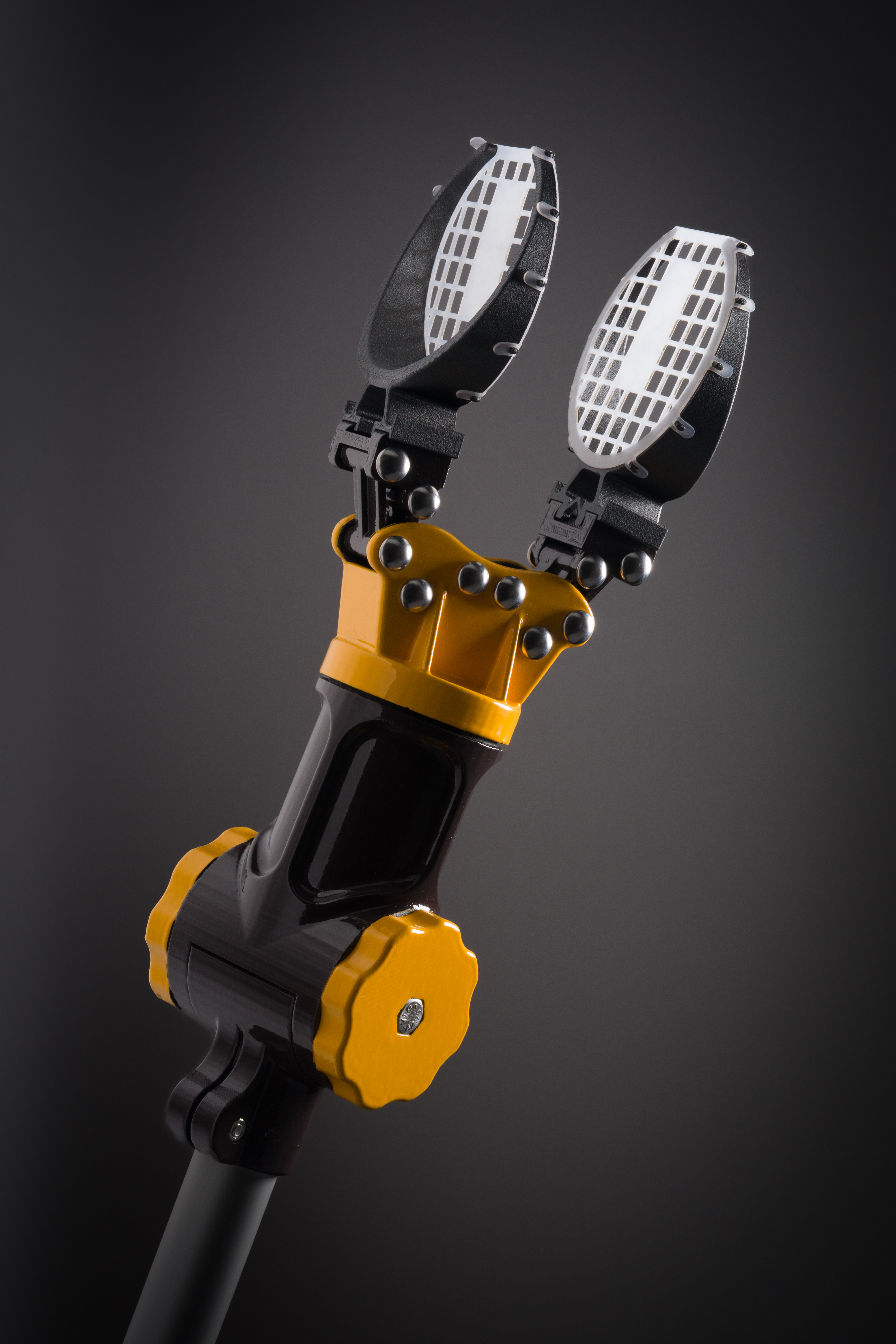 a black and yellow robotic arm