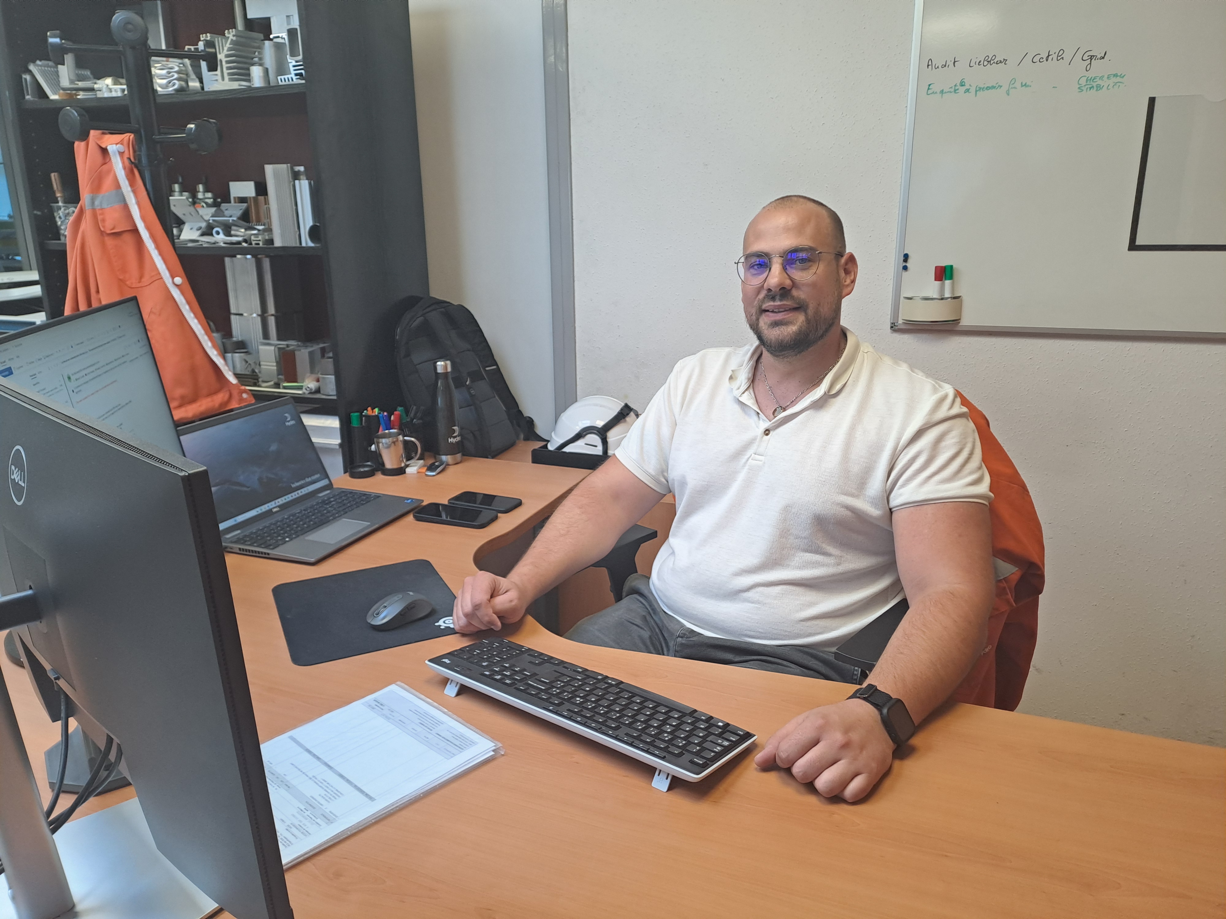 a man sitting at a desk with a computer