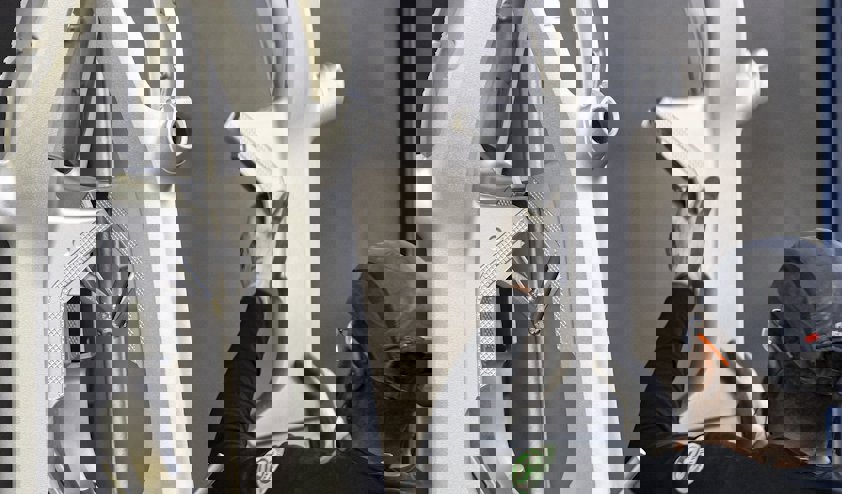 a person holding a large piece of machinery