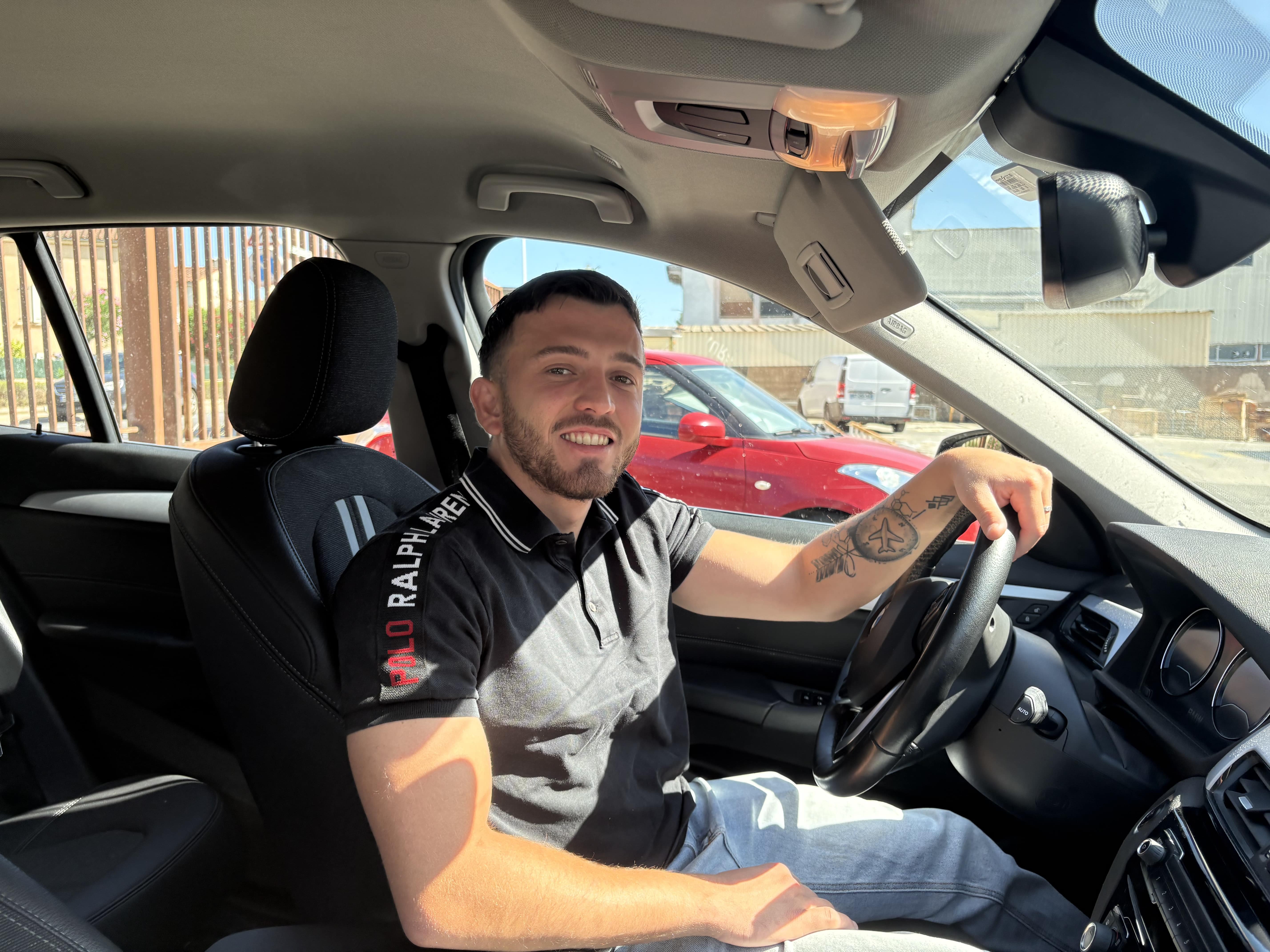 a man sitting in a car